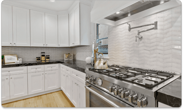 Remodeled kitchen. Black granite with a propane stove.