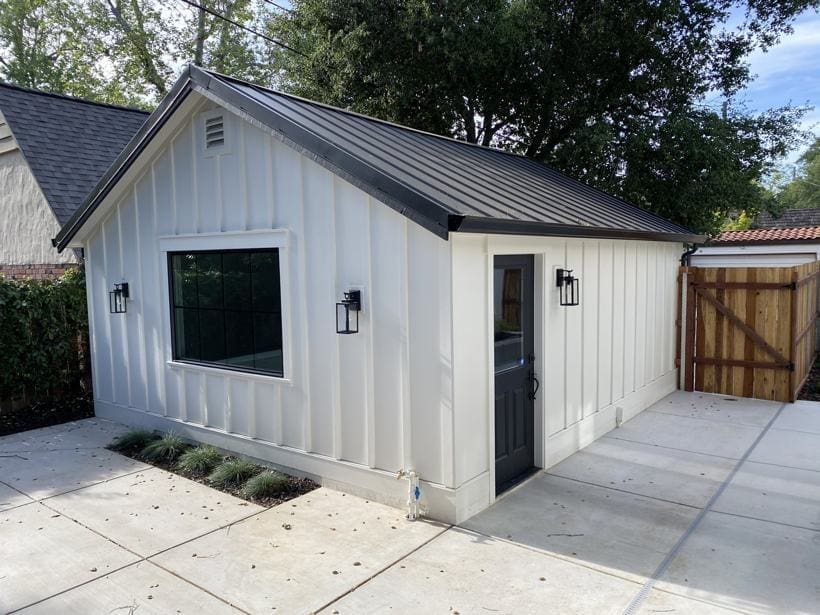 Detached structure clad in board-and-batten siding